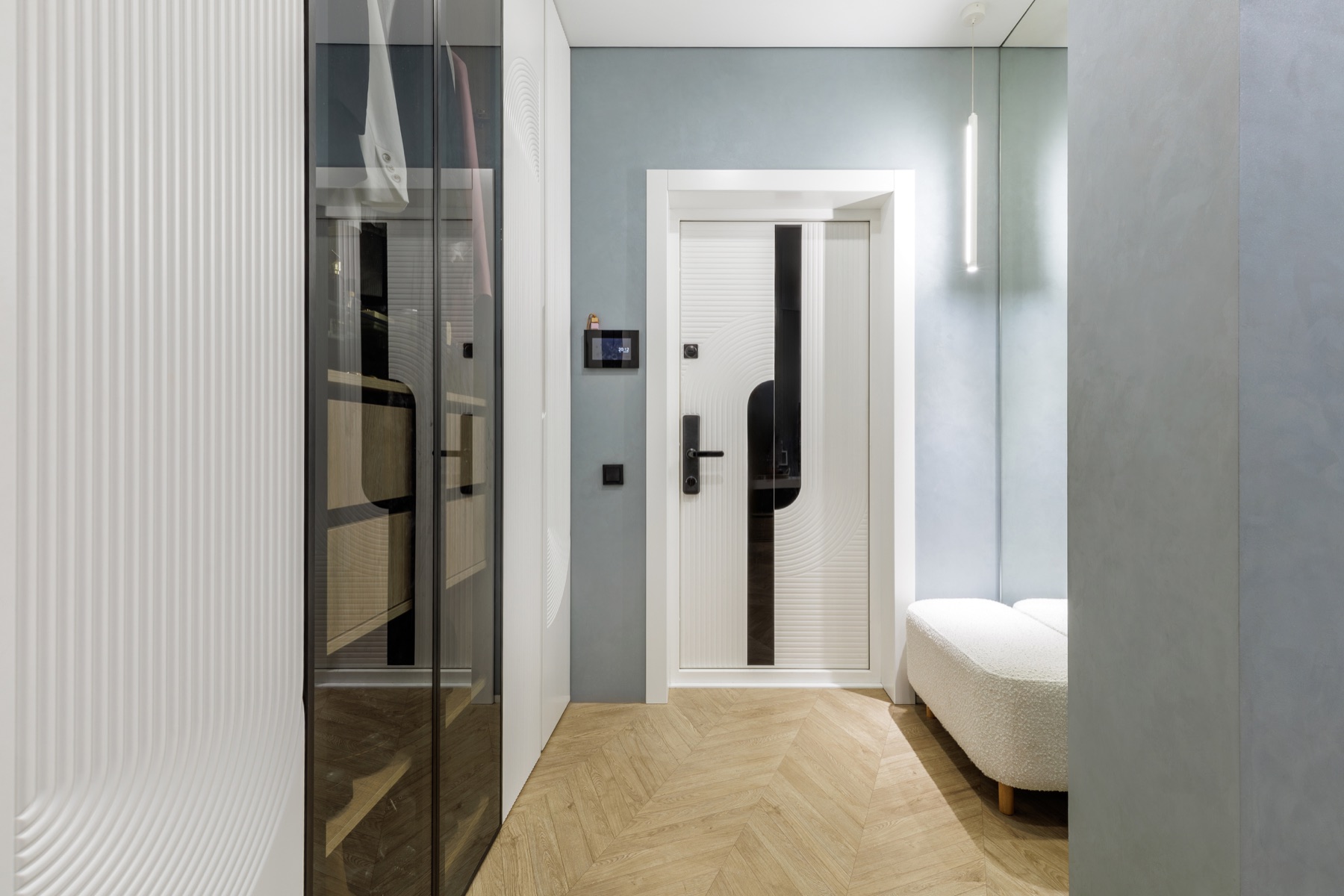 Contemporary secure door integrated into a refined residential hallway
