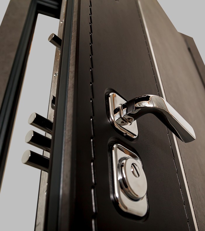 Electronic keypad lock mounted on a wood safe room door