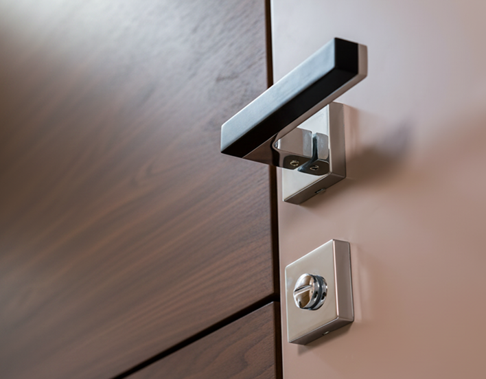 Ornate wooden gun-room door with discreet locking hardware